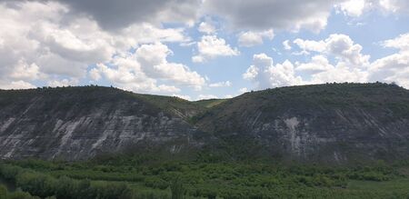 mountain view in summer, cloudy sky