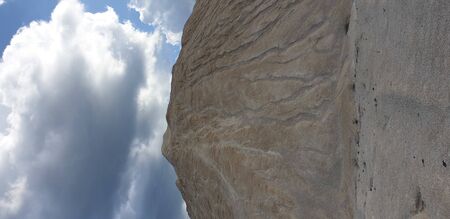 dunes of limestone, white dunes against the cloudy skyの写真素材