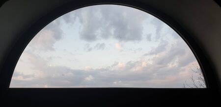 beautiful bright white and gray clouds on a blue sky, pink Sunrise, bright colorful sky at sunriseの写真素材