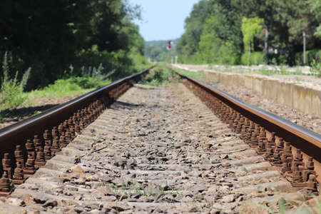 summer walk on abandoned railway tracks, old rusty tracksの写真素材