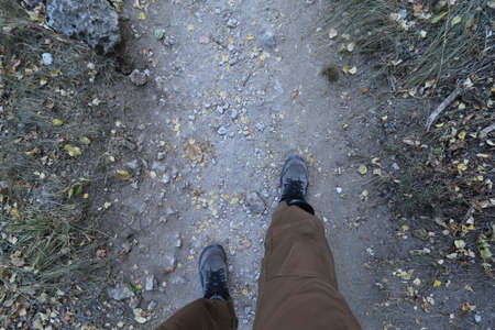 walk the dusty trail, feet walk forward on the roadの写真素材