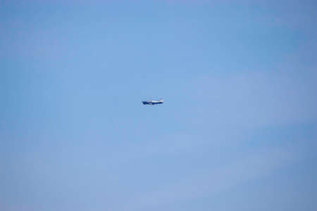 helicopter in blue summer sky by day, air transport