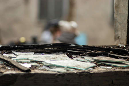 old window and broken glass on the windowsillの写真素材