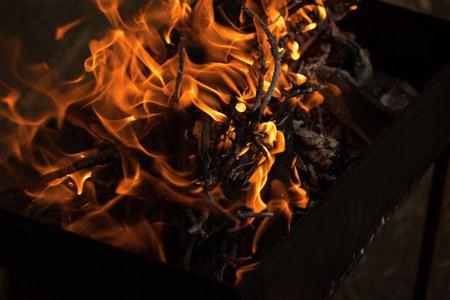 flames in the dark, a bright fire on a dark backgroundの写真素材
