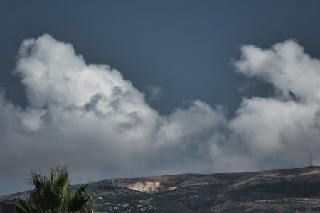 Summer holiday in the mountains, fluffy fairytale clouds over the mountains in Vlore, Albania - August 23, 2025の写真素材