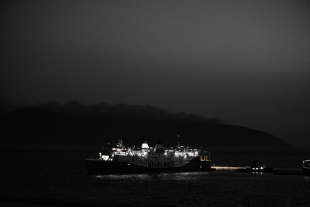 VlorÃ«, Albania â€“ August 21, 2025: Nighttime scenes of the coastal harbor featuring...
