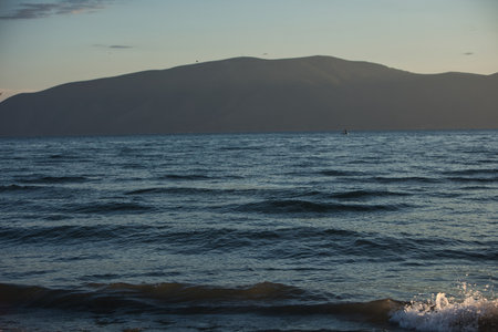 A serene coastal view of Vlora, Albania, captured on August 24, 2025. Gentle waves shimmer under...