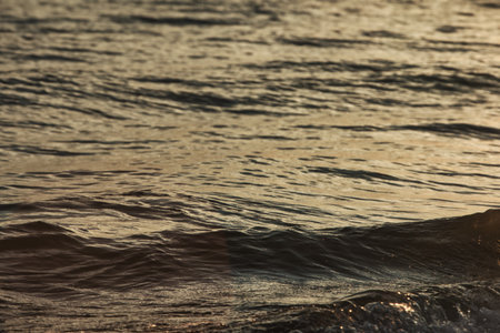 Deep blue waves crash against the rocky shoreline in Vlora, Albania, captured on August , 2025の写真素材