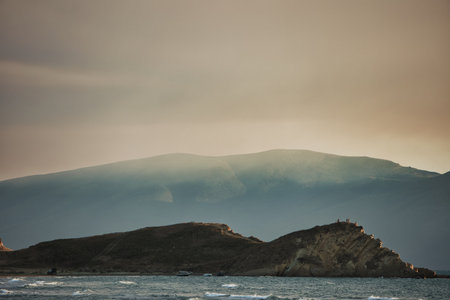 Moody coastal landscape in Vlora, Albania, captured on August 25, 2025. A layer of haze drifts over...