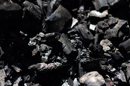 Burning charcoal in the garden, close-up of ashes.