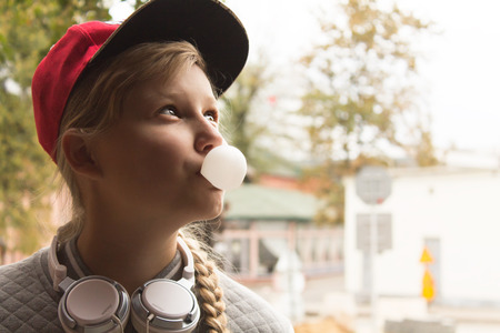 Teen Girl and Chewing Gum in the Sity