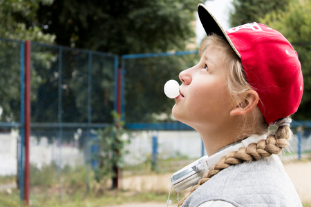 Teen Girl and Chewing Gum in the Sityの写真素材