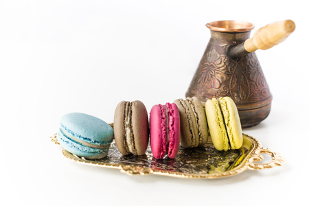 French Colorful Macarons with Pots on a White Backgroundの写真素材