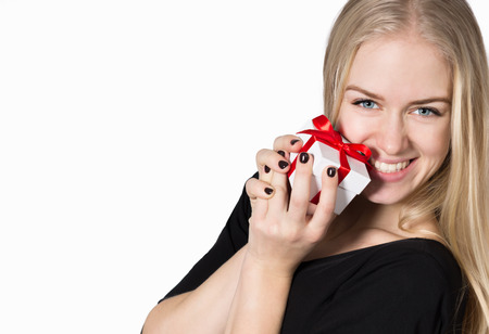 Happy Young Woman with a Gift in the Hands Isolated on White Background