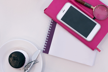 A Pink Notebook with a Cake. Flat Layの写真素材