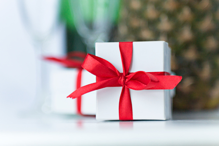 Still Life from Gift Boxes with Champagne and Pineappleの写真素材