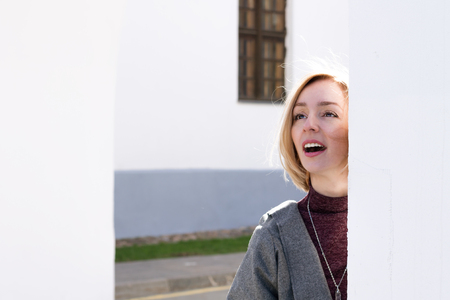 An Adult Woman is Smiling in the Cityの写真素材