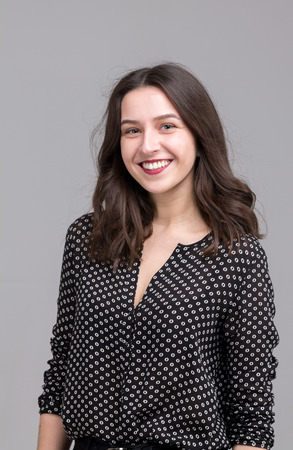 Modern Cheerful Young Woman Isolated in Studioの写真素材