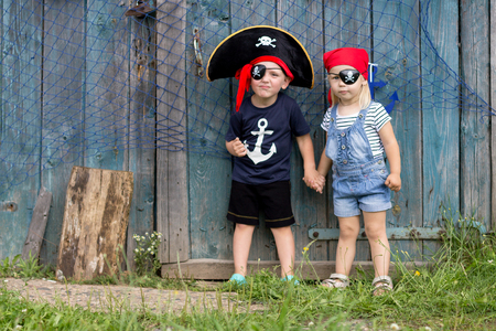 Boy and Girl in Pirate Costume Outdoors. Masquerade Holidayの写真素材