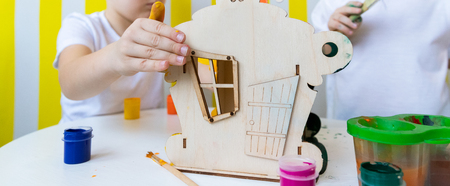 Children Paint Paints House. Bird feeders. Spring Concept. Childhoodの写真素材