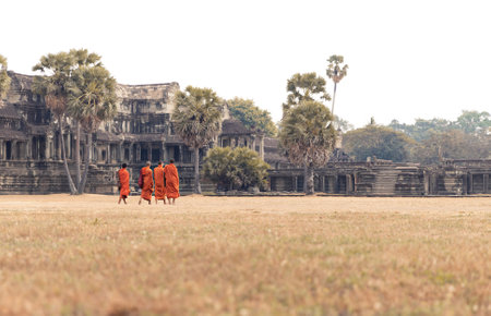 Cambodia. Angkor Wat. 02.2019 Several Monks in the Orange Ryasa Go to the Palaceのeditorial素材