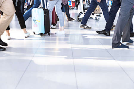 Bangkok. Thailand 02.2019 Human Legs with Luggage at the Airport. Journey. Background