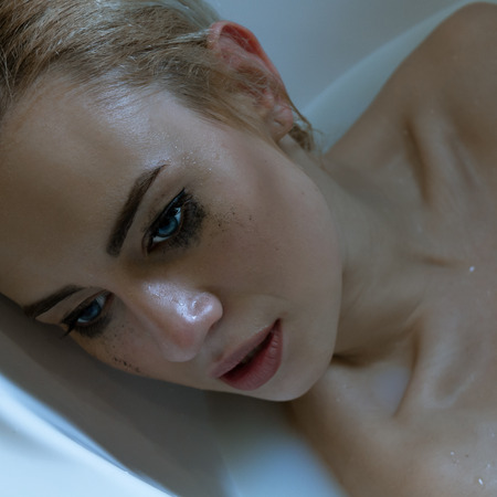 Beautiful Woman Crying. Depressive Concept. Loneliness and Tearsの写真素材