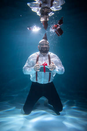 A Man Rejoices Many Gifts. Festive Conceptの写真素材