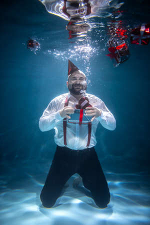 A Man Rejoices Many Gifts. Festive Conceptの写真素材
