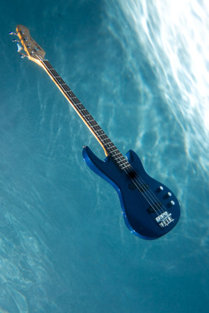 Free Guitar Underwater. Copy Space. Singing and Music