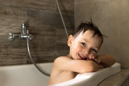 Child Boy Washes in the Bathroom. Copy Space