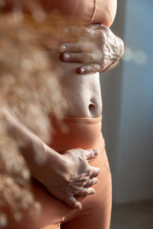 Womens sports belly in sportswear. Feminine Conceptの写真素材