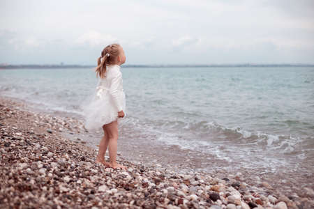 Child Girl in White Dress. Portraitの写真素材