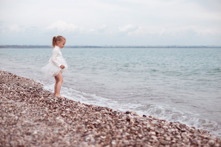 Child Girl in White Dress. Portraitの写真素材