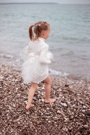 Cute Little Girl in a White Dressの写真素材