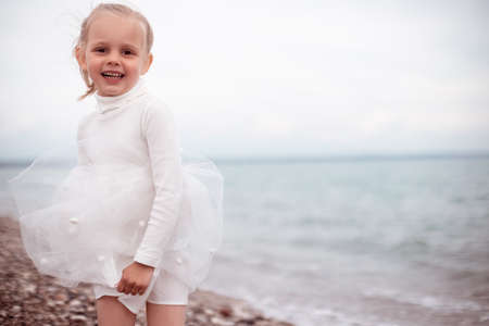 Cute Little Girl in a White Dressの写真素材
