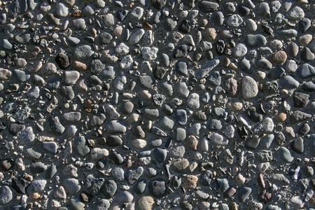 Texture, landscape style photo of aggregate rock imbeded in concrete の写真素材
