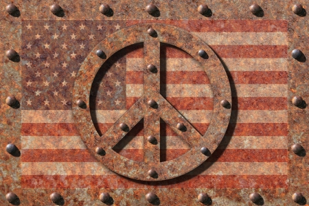 Riveted edges on rusted steel plate with faded american flag, in front a riveted rusted peace symbol.の写真素材