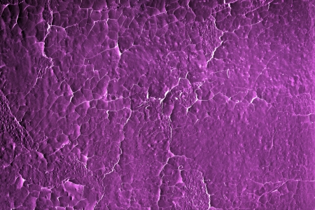 Aged Cracked Iridescent Magentaon an old wall  Original color of white was filtered to create this brilliant hue  の写真素材