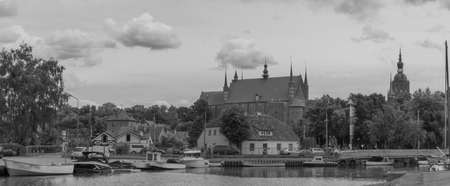 Black and white photo - panorama of Frombork, Frauenburg on a summer day. The city where Nicolaus...