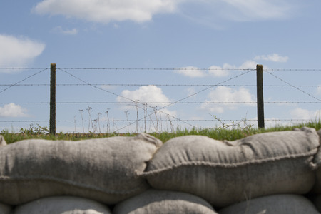 trenches with barbed wire and sandbags world war oneの写真素材