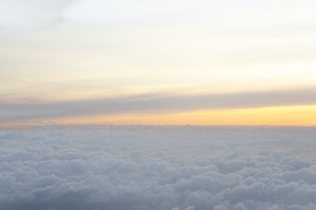 High above the clouds with beautiful sunset light