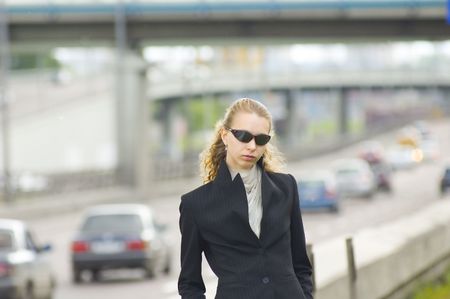 Business woman near the roadの写真素材