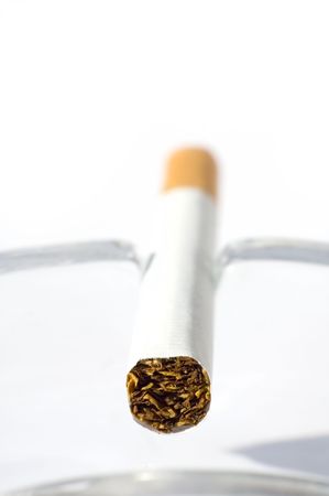 Cigarette in ash trayの写真素材