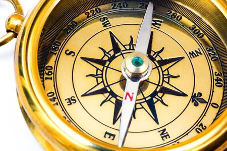 Old style gold compass on white backgroundの写真素材