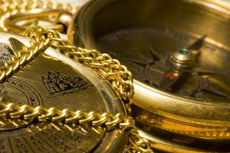Old style gold compass & calendar closeupの写真素材