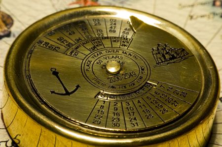 Old style gold calendar on antique  mapの写真素材