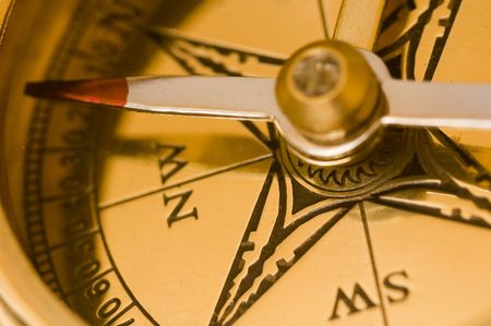 Old style brass compass on white background Old style brass compass on white background