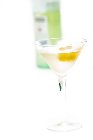 Glass with martini and olives isolated on white backgroundの写真素材