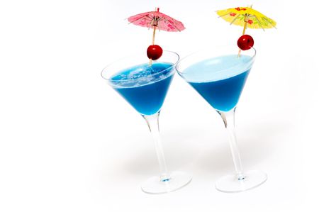 Cocktails with blue curacao isolated on whiteの写真素材